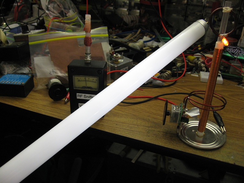 Tiny Tesla Coil lighting fluorescent tube.