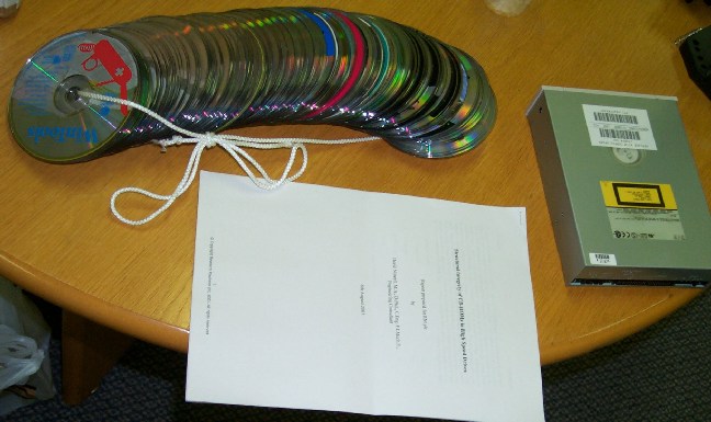 media collection, paper printed copy, and an old CD-ROM drive